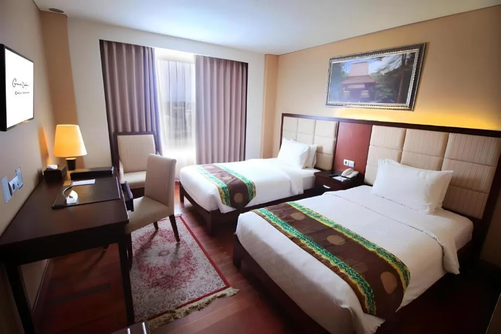 Bed in Grand Qin Hotel Syariah