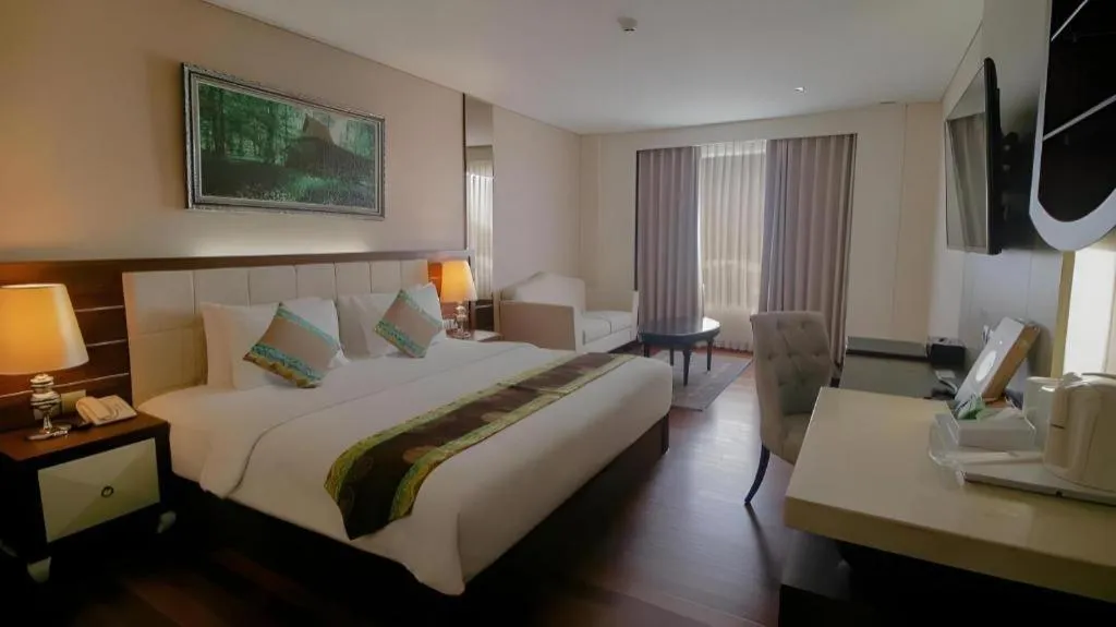 Bed in Grand Qin Hotel Syariah