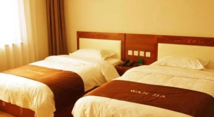 Bed in Beijing Wanjia Traders Hotel