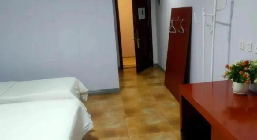 Bed in Beijing Wanjia Traders Hotel