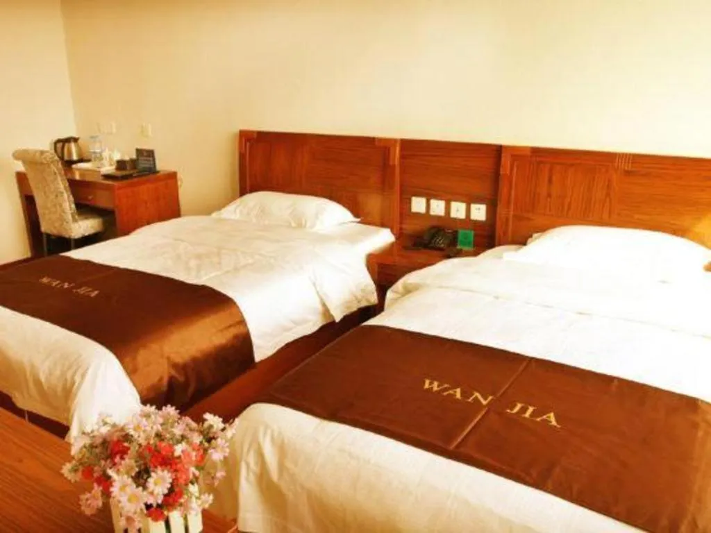 Bed in Beijing Wanjia Traders Hotel