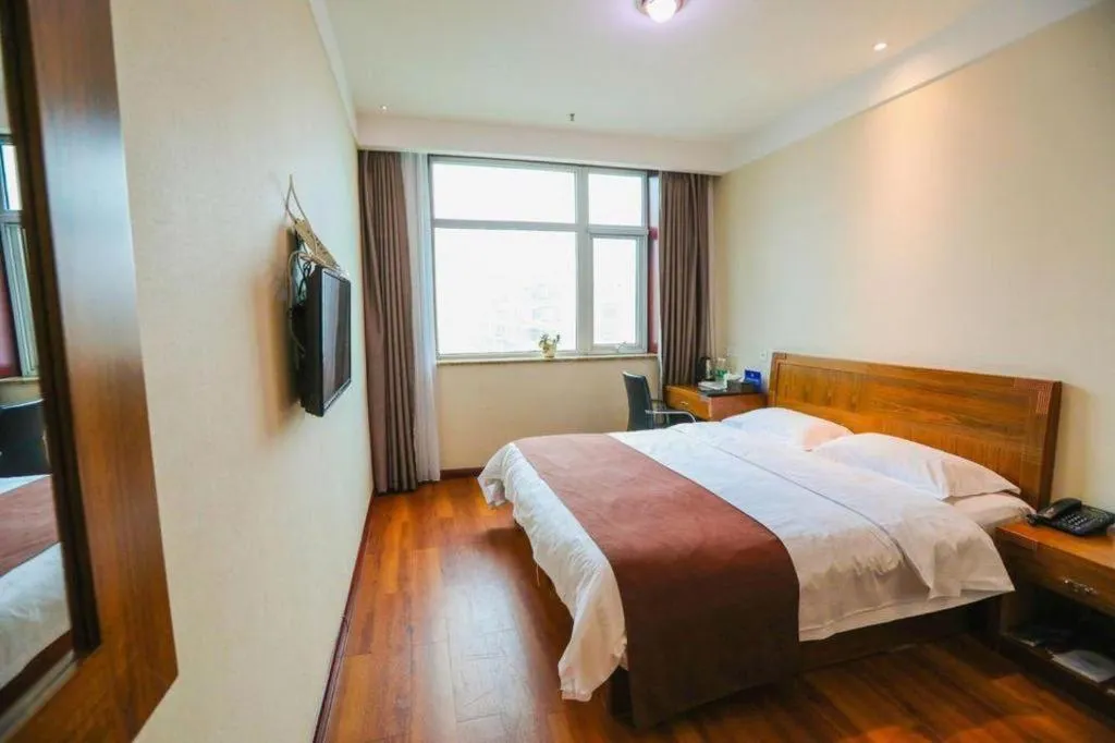 Bed in Beijing Wanjia Traders Hotel