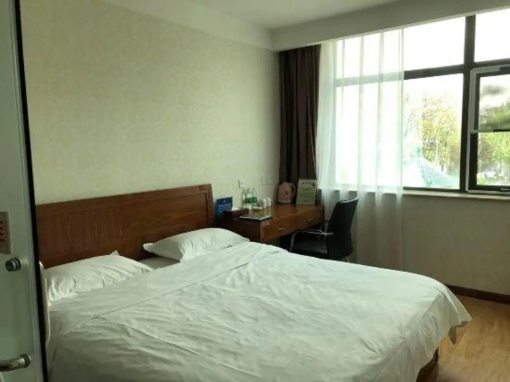 Bed in Beijing Wanjia Traders Hotel