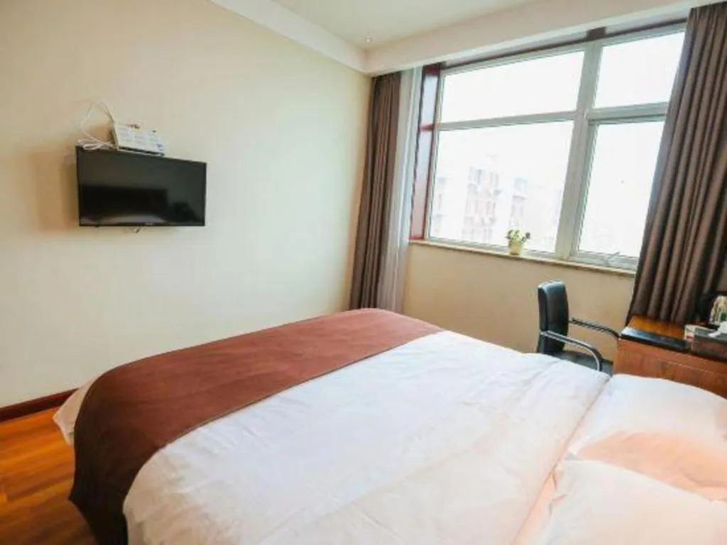 Bed in Beijing Wanjia Traders Hotel