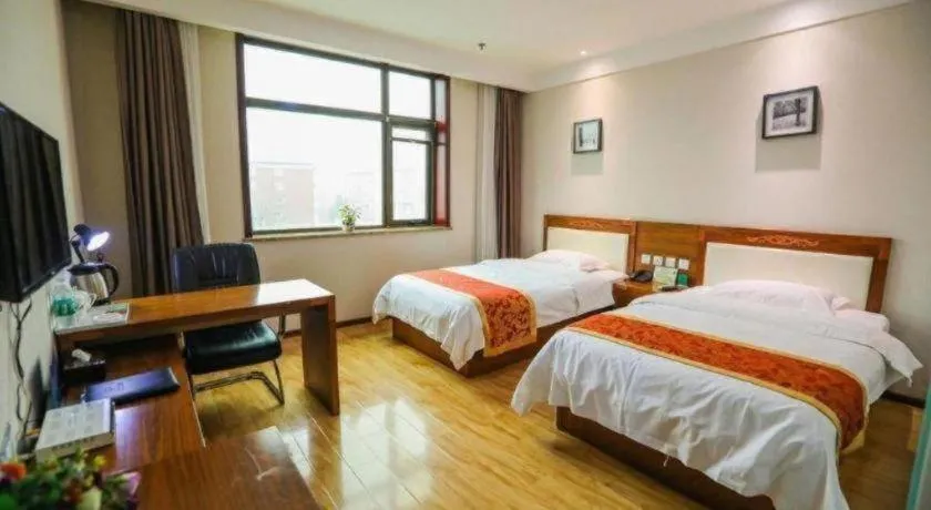 Bed in Beijing Wanjia Traders Hotel