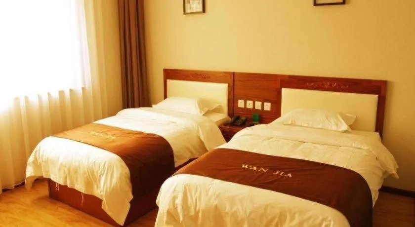 Bed in Beijing Wanjia Traders Hotel