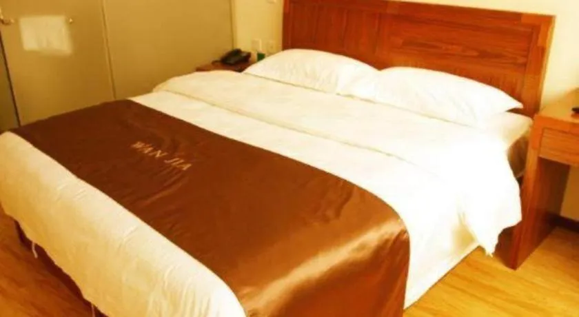 Bed in Beijing Wanjia Traders Hotel