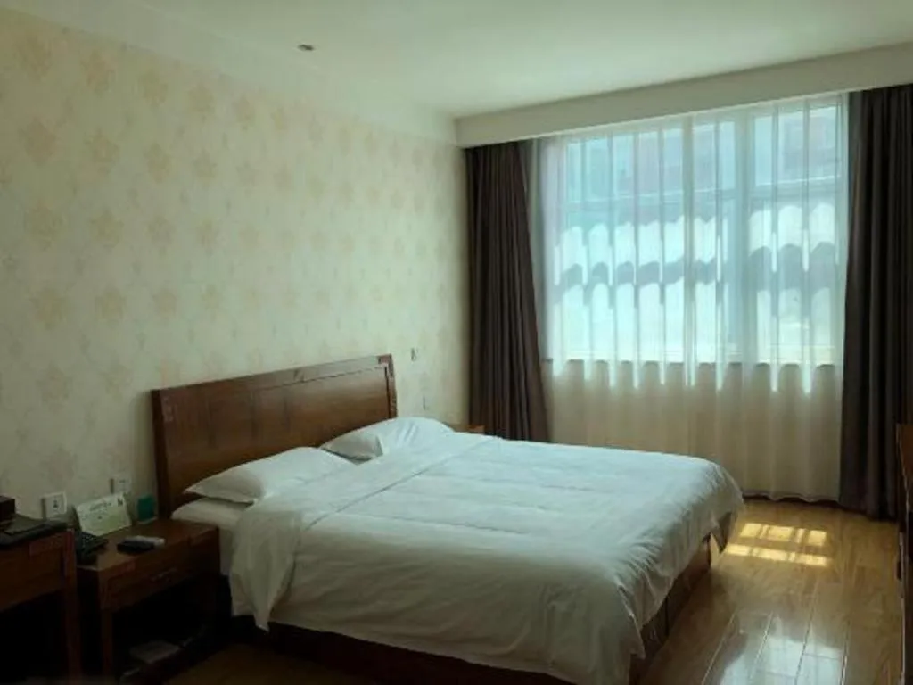 Bed in Beijing Wanjia Traders Hotel