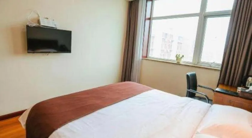 Bed in Beijing Wanjia Traders Hotel