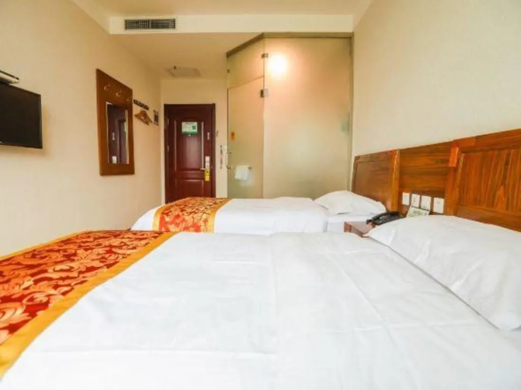 Bed in Beijing Wanjia Traders Hotel