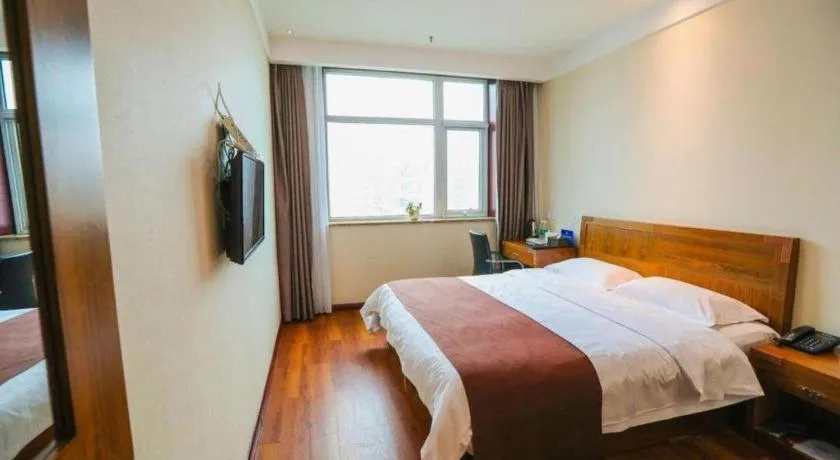 Bed in Beijing Wanjia Traders Hotel