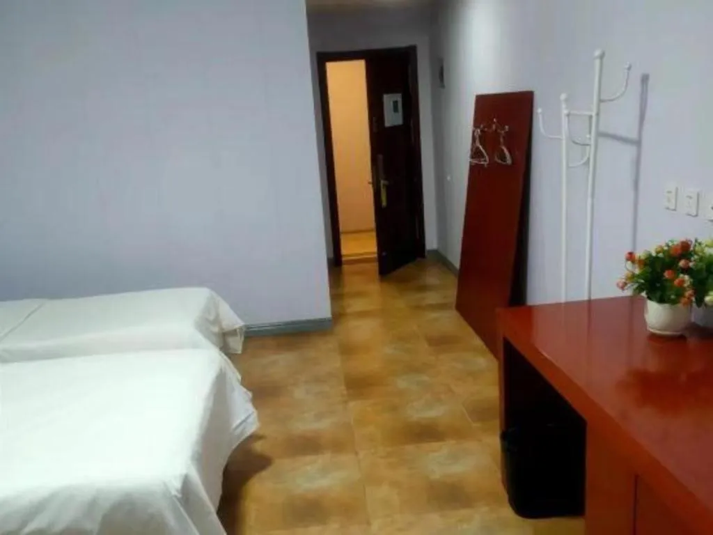 Bed in Beijing Wanjia Traders Hotel