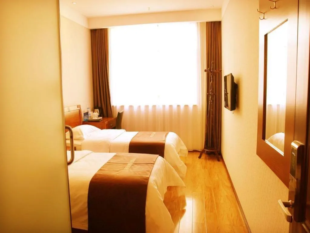 Bed in Beijing Wanjia Traders Hotel