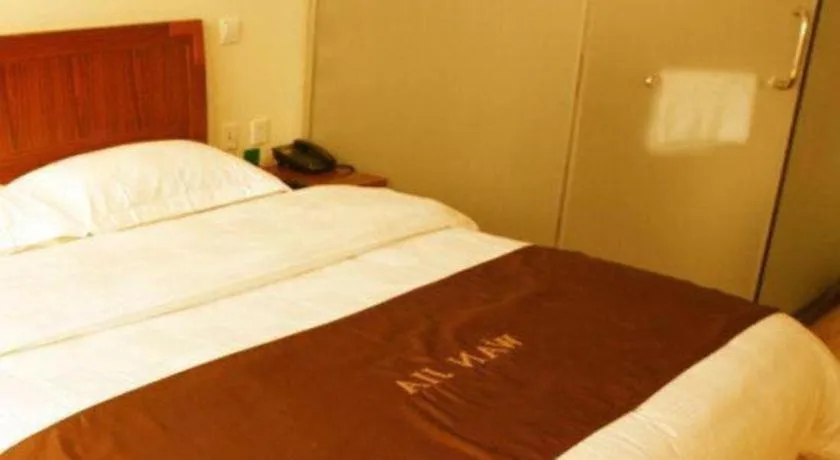 Bed in Beijing Wanjia Traders Hotel