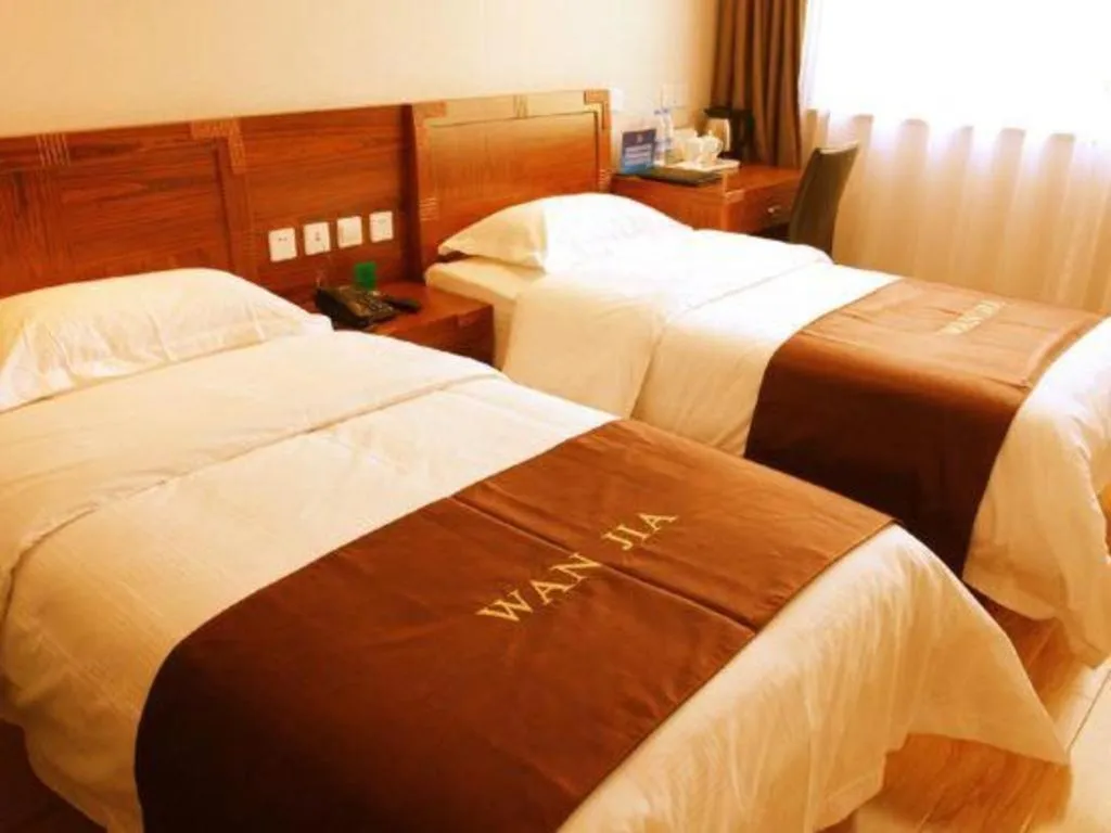 Bed in Beijing Wanjia Traders Hotel