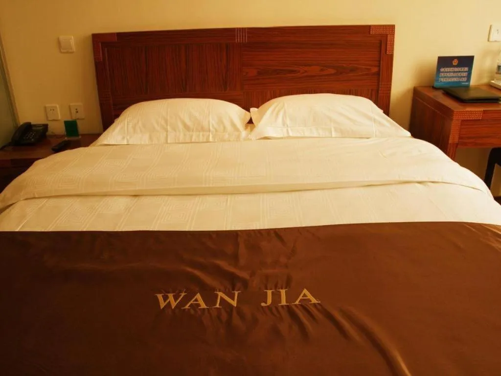 Bed in Beijing Wanjia Traders Hotel