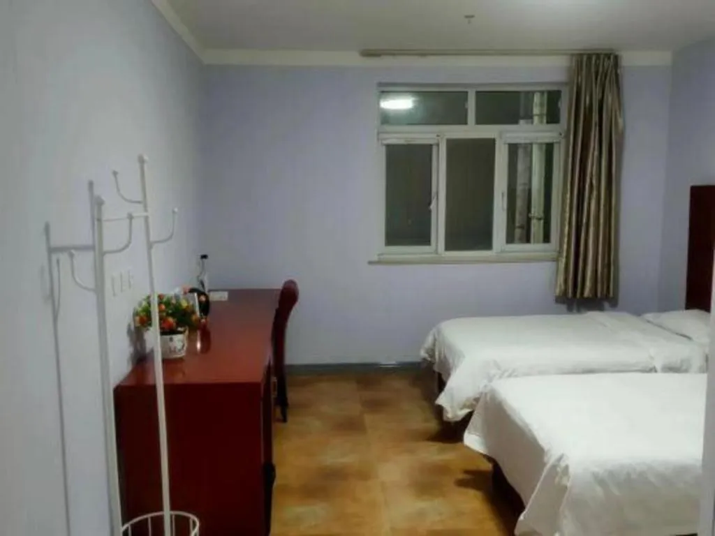 Bed in Beijing Wanjia Traders Hotel