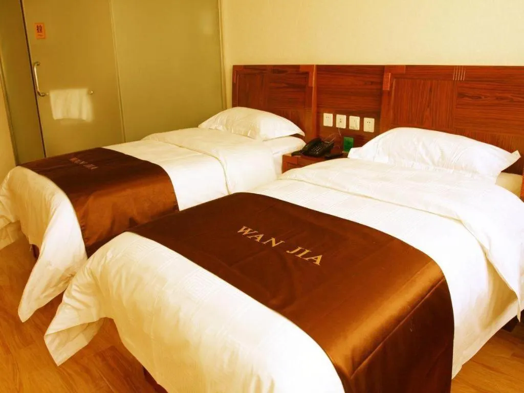 Bed in Beijing Wanjia Traders Hotel