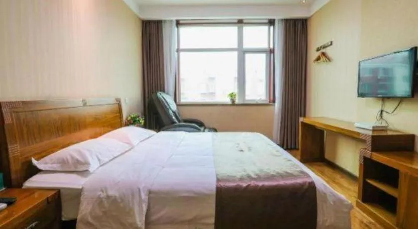 Bed in Beijing Wanjia Traders Hotel