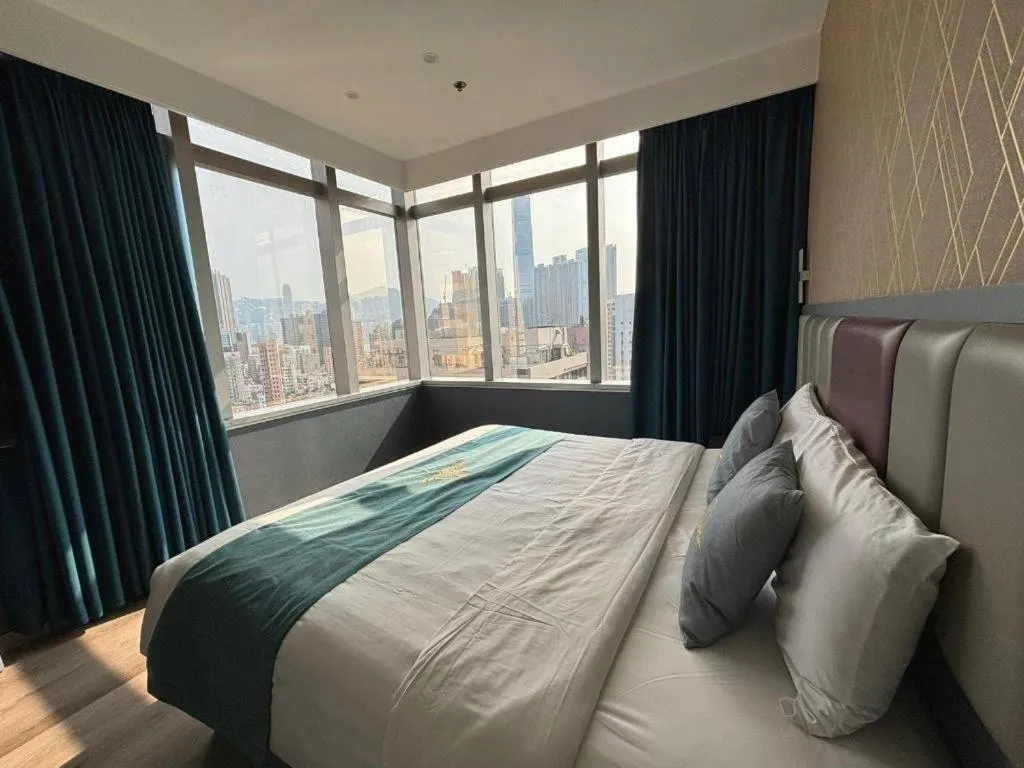 Bed in Metro Winner Hotel