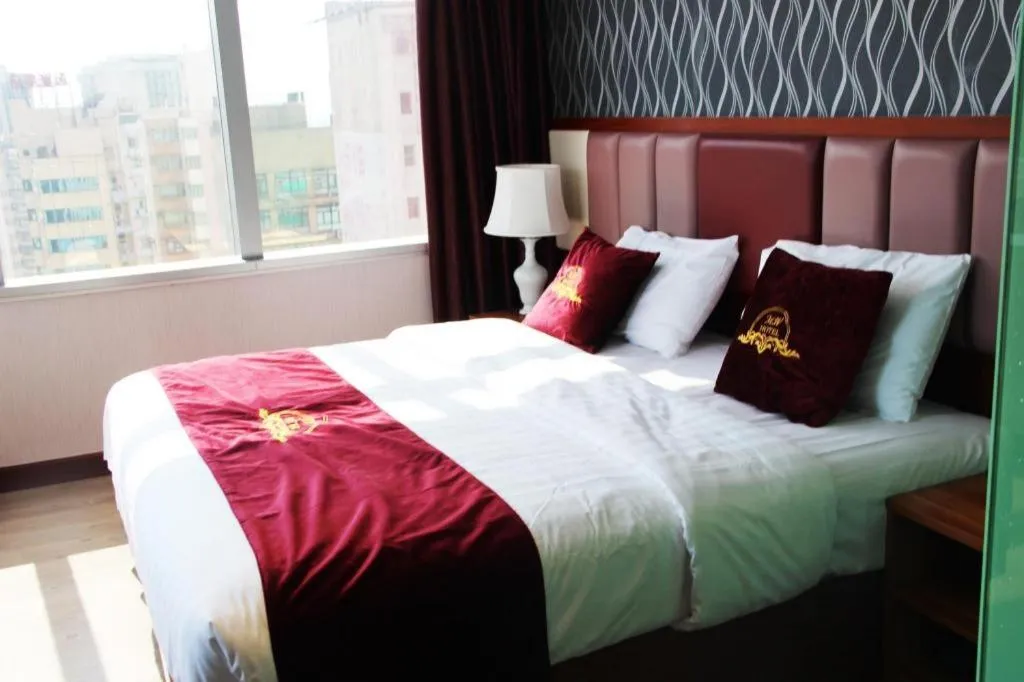 Bed in Metro Winner Hotel
