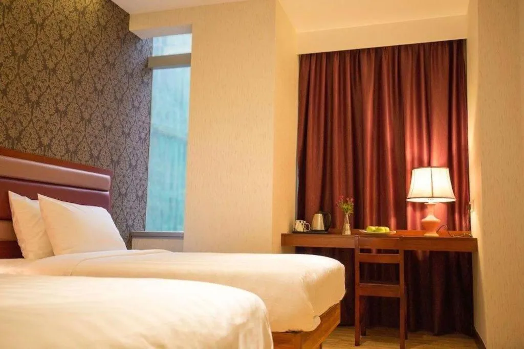 Bed in Metro Winner Hotel