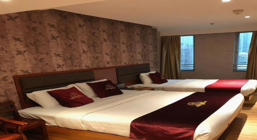 Bed in Metro Winner Hotel