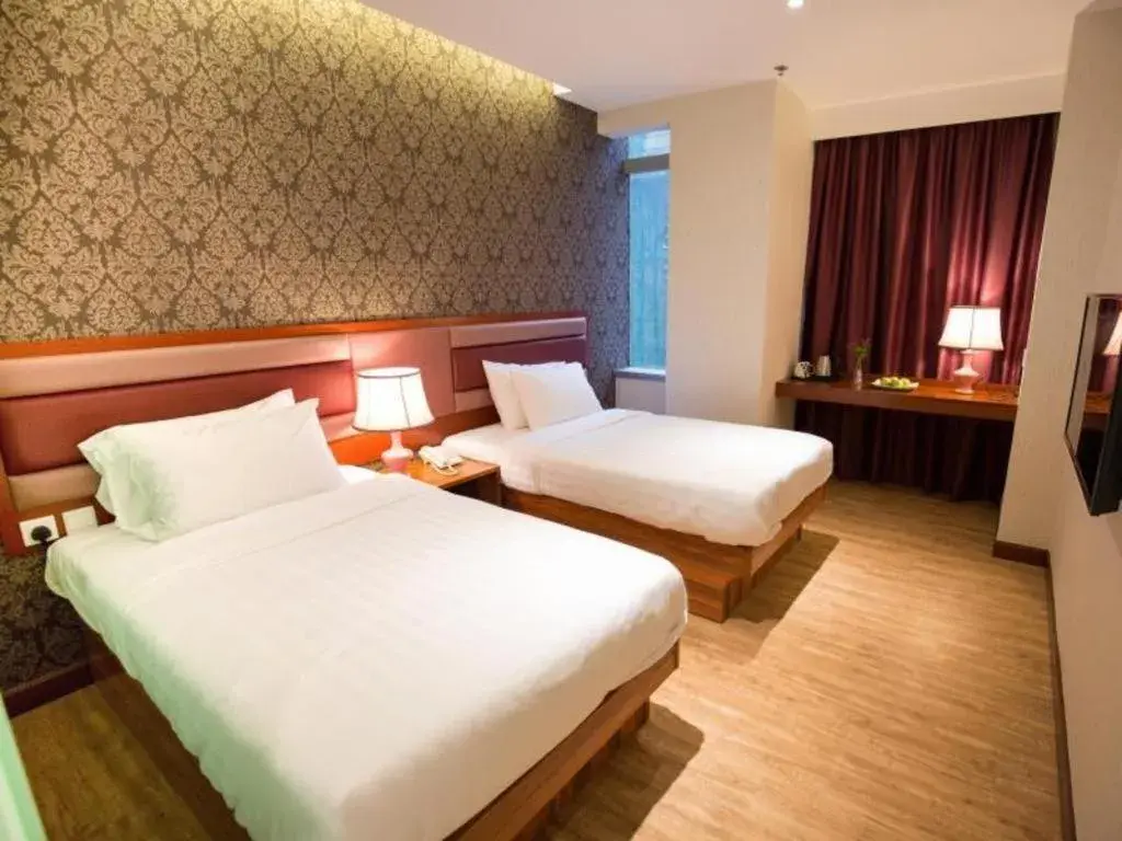 Bed in Metro Winner Hotel Bed in Metro Winner Hotel