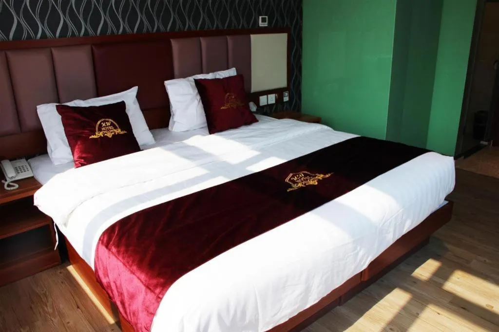 Bed in Metro Winner Hotel