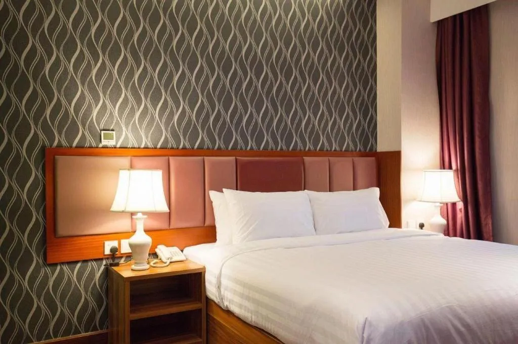 Bed in Metro Winner Hotel