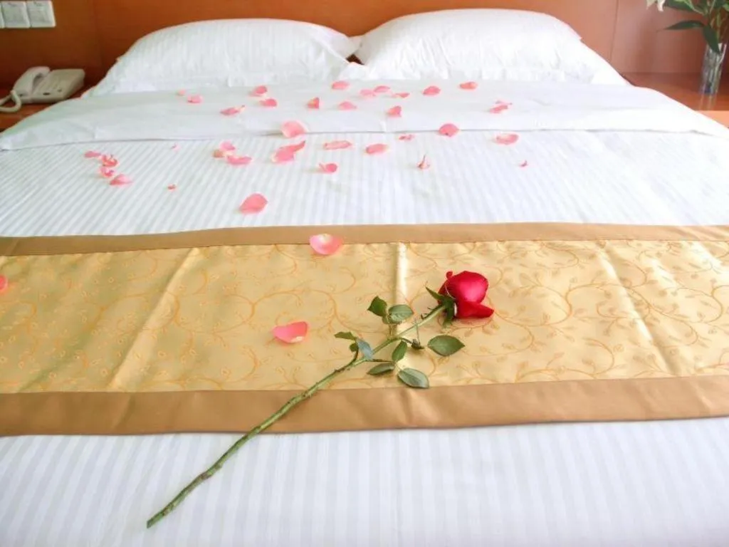 Bed in Vatica Tianjin Jinghai Bus Station Home World Plaza Hotel