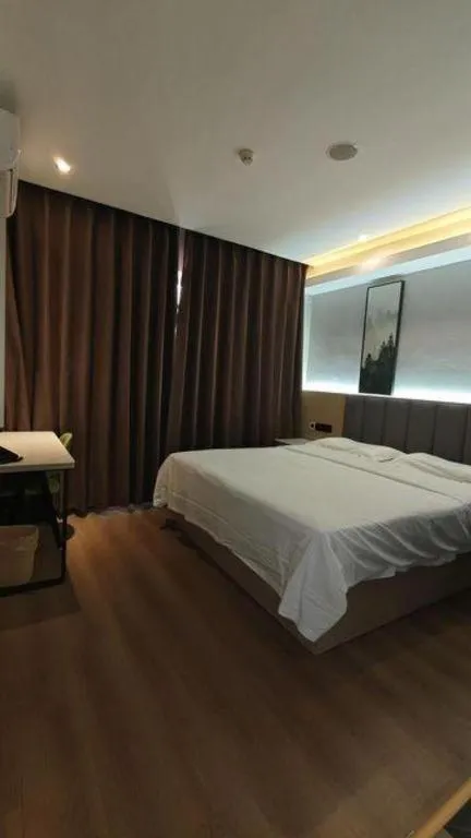 Bed in Vatica Tianjin Jinghai Bus Station Home World Plaza Hotel