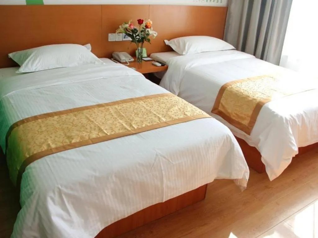Bed in Vatica Tianjin Jinghai Bus Station Home World Plaza Hotel