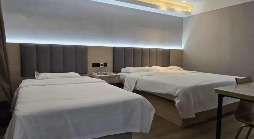 Bed in Vatica Tianjin Jinghai Bus Station Home World Plaza Hotel