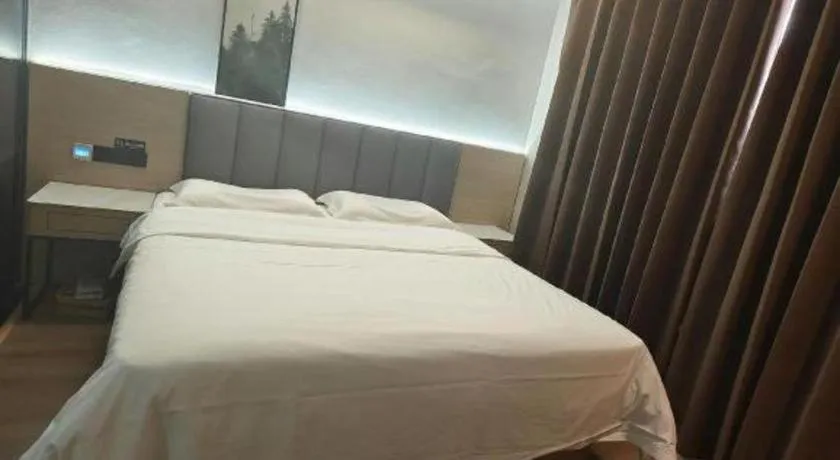 Bed in Vatica Tianjin Jinghai Bus Station Home World Plaza Hotel