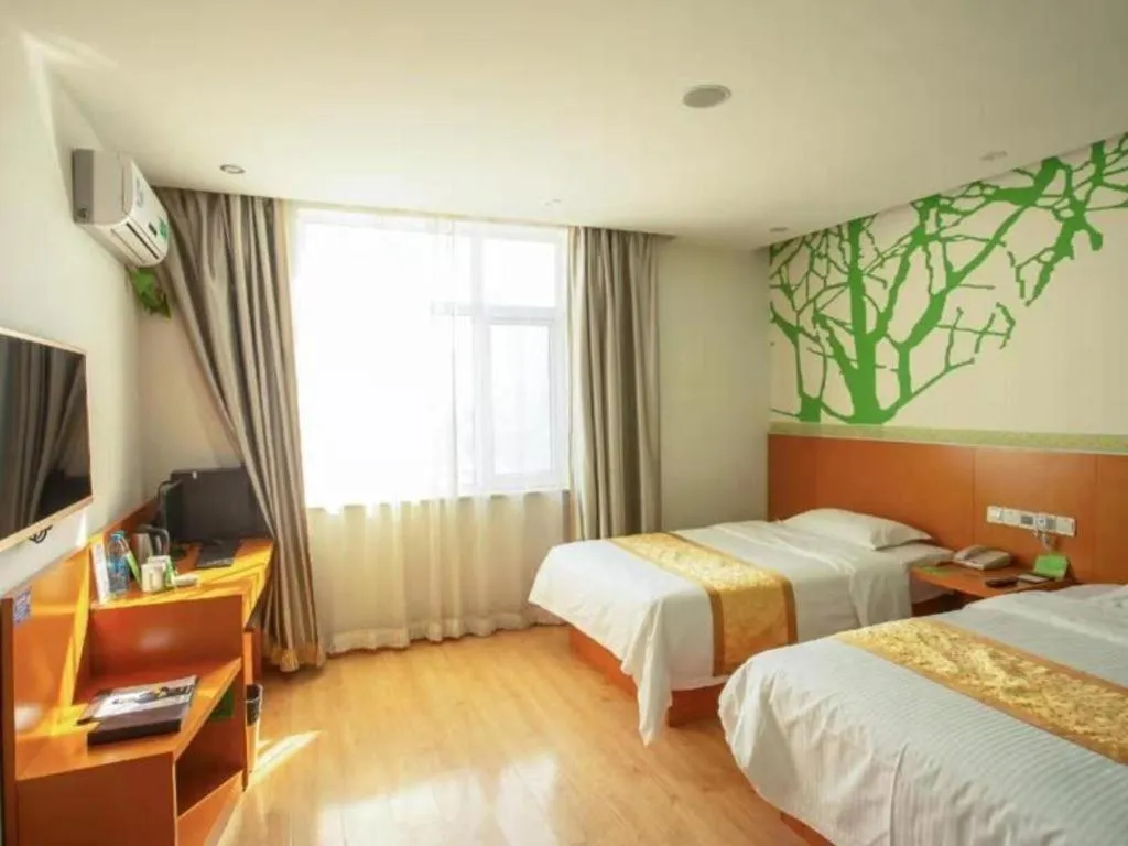 Bed in Vatica Tianjin Jinghai Bus Station Home World Plaza Hotel