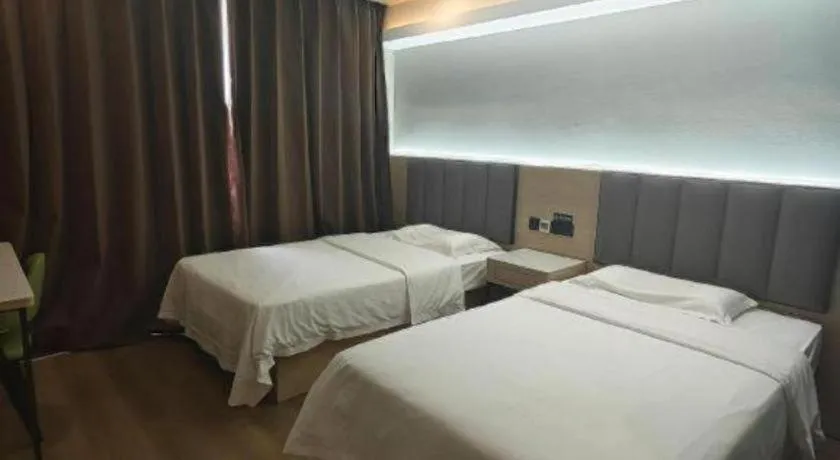 Bed in Vatica Tianjin Jinghai Bus Station Home World Plaza Hotel