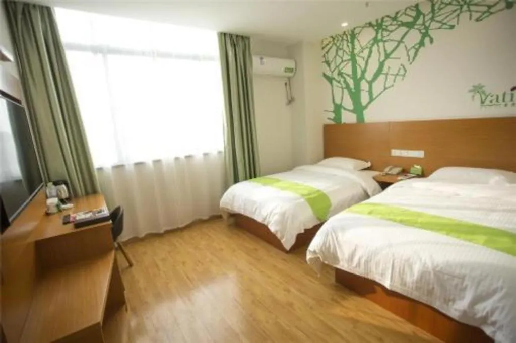 Bed in Vatica Tianjin Jinghai Bus Station Home World Plaza Hotel