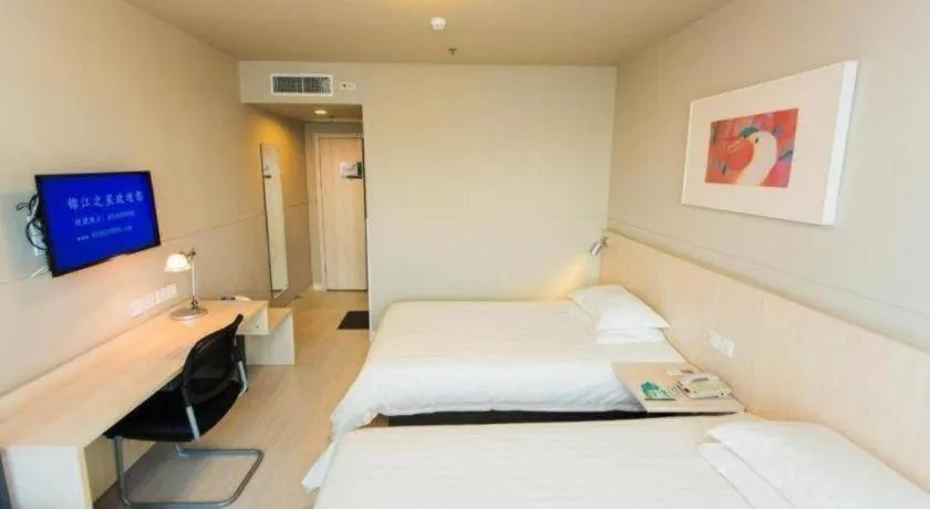 Bed in Jinjiang Inn Hohhot Dazhao Hospital Metro Station