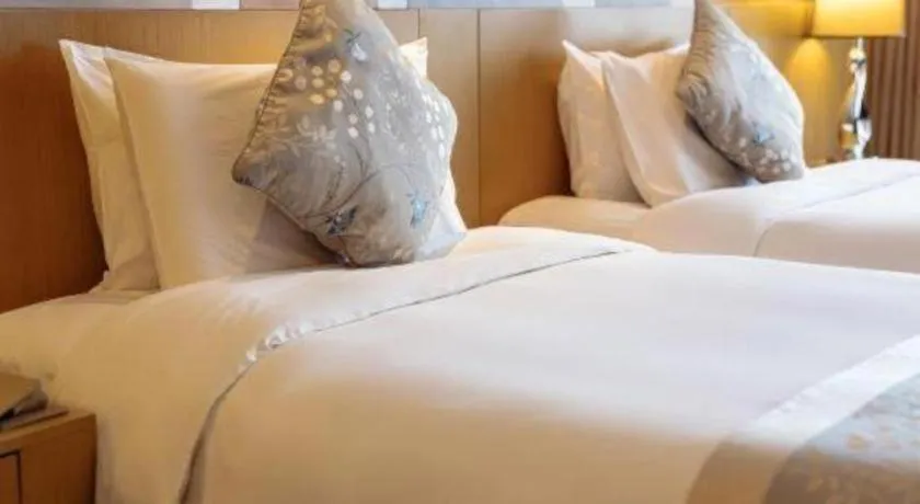 Bed in CITIC Jinling Hotel