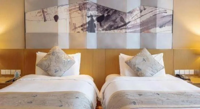 Bed in CITIC Jinling Hotel