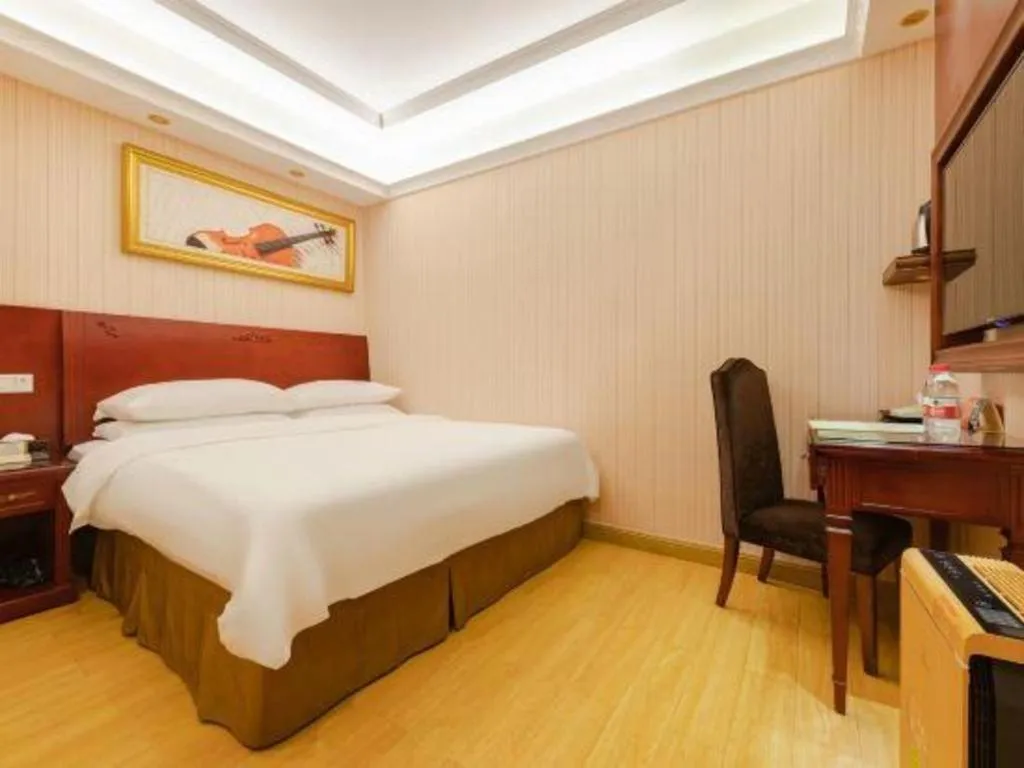 Bed in Vienna Hotel Shenzhen Exhibition Center Gangxia Metro Station