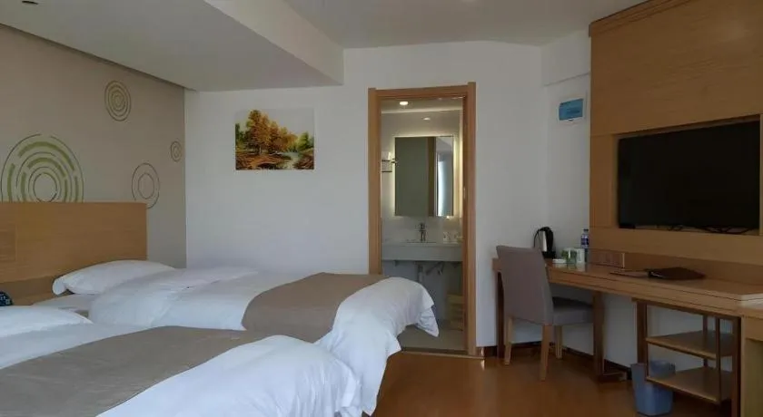 Bed in GreenTree Inn Anqing Qianshan County Sunshine City Express Hotel