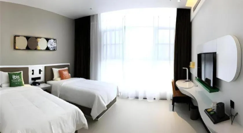 Bed in ibis Styles Kunming Nanping Hotel