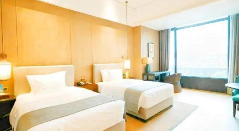 Bed in Jolie Vue Boutique Hotel Sanjiang