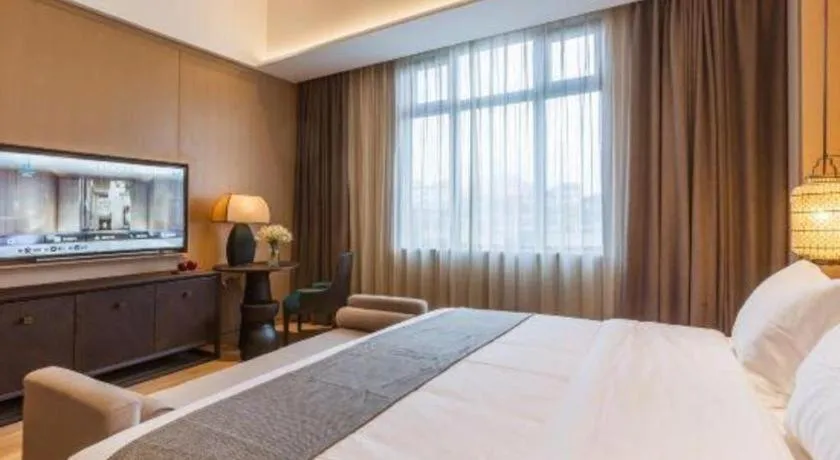 Bed in Jolie Vue Boutique Hotel Sanjiang