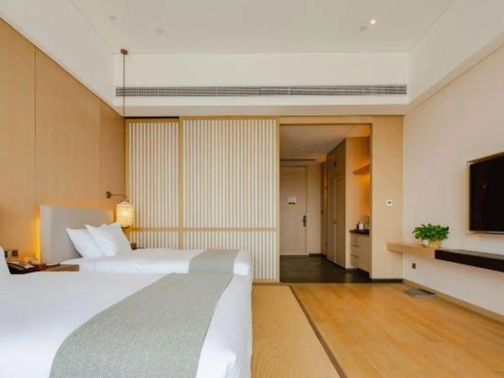 Bed in Jolie Vue Boutique Hotel Sanjiang