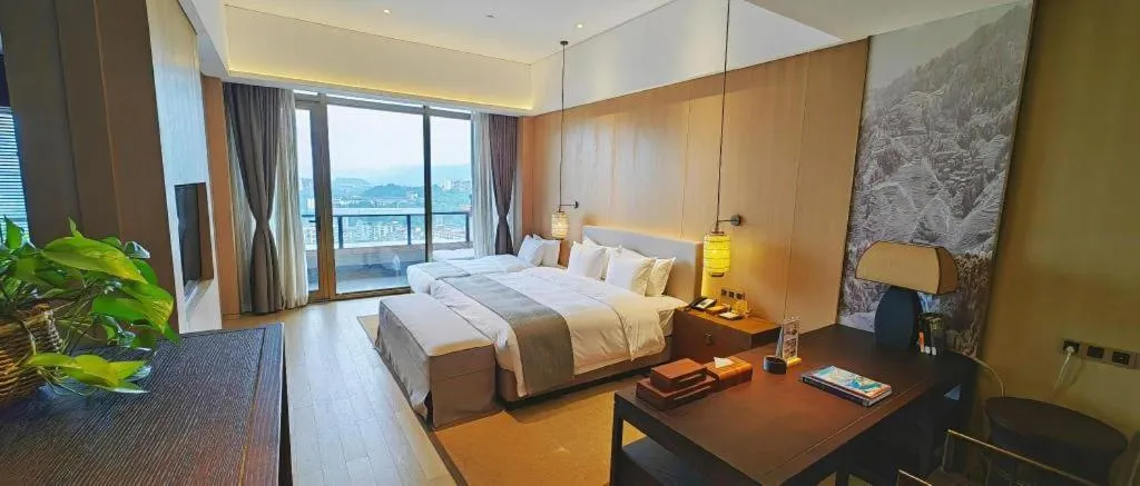 Bed in Jolie Vue Boutique Hotel Sanjiang