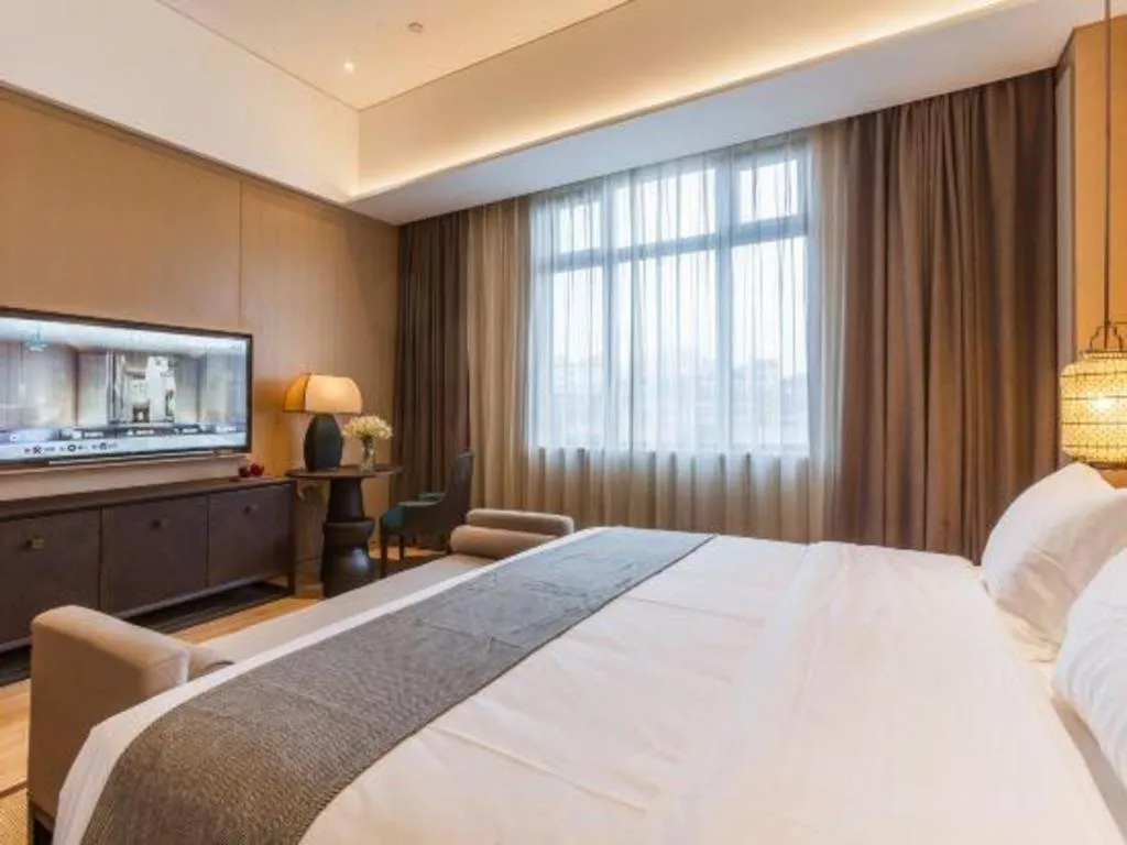 Bed in Jolie Vue Boutique Hotel Sanjiang
