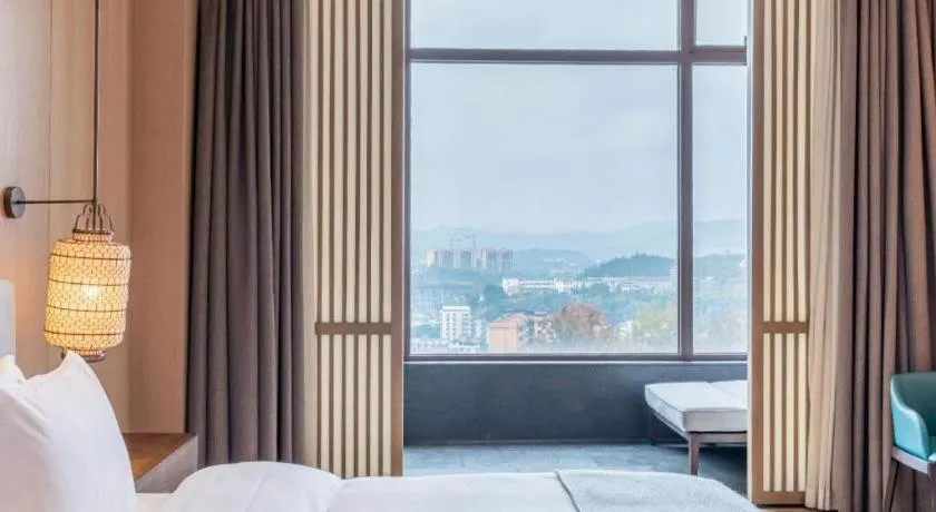 Bed in Jolie Vue Boutique Hotel Sanjiang